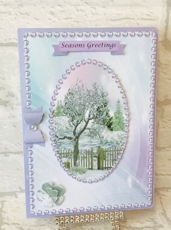 Winter scene with lilac flowers and lilac pearls by Anita Henery