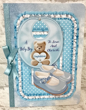 A baby boy and a baby girl toppers by Anita Henery