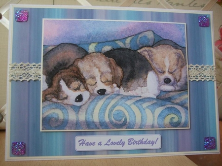 Beagle Puppies Asleep on the Sofa by Ann-Marie Lawson