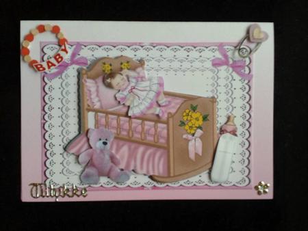 Sleeping Baby Girl in Pink Crib with Lace and Bows by Ann-Marie Mathiesen