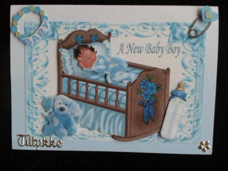 Baby Boy Sleeping in Blue Crib with Cuddly Toy by Ann-Marie Mathiesen