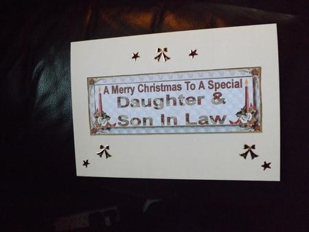 Daughter & Son in Law Christmas Dl Card Front by Ann McKenzie