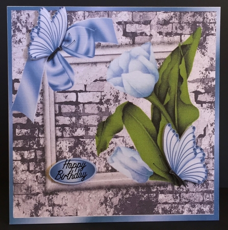 pretty corner blue tulips & butterflies with brick effect wall 8x8 by Anne Sutherland