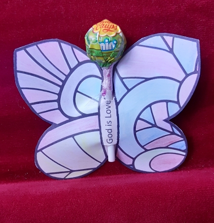 Bible verse colouring butterfly lollipop holders – God is love by Anne Jackson