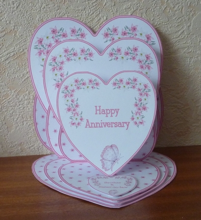 Pink and white triple heart easel anniversary card with matching envelope. by Anne Jackson