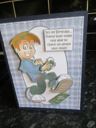 Teen Boy Too Busy to Check His Phone by Anne-marie Wheeler