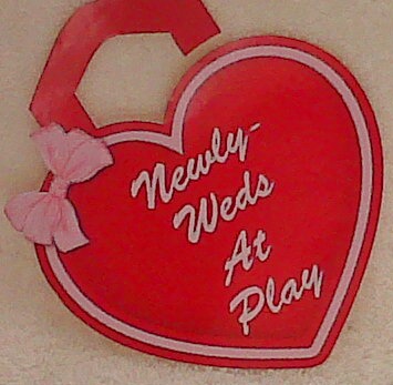 Newly Weds at Play Heart Shaped Door Hangers by Annette Crossley