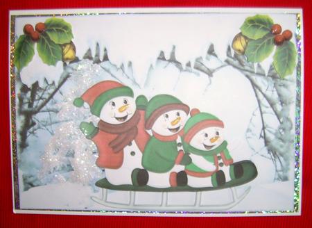 Snowmen Playing in the Snow on a Sledge by Annmarie Spriggs