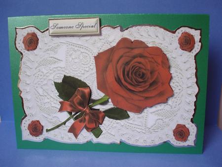 Single Red Rose with Bow on Ecru Lace by Audrey Brown clifford