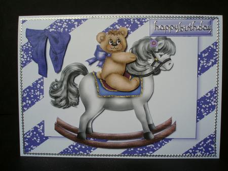 Cute Teddy on a Rocking Horse by Audrey Brown clifford
