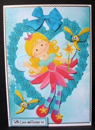 Rainbow Faerie in Heart Frame of Roses by Audrey Brown clifford