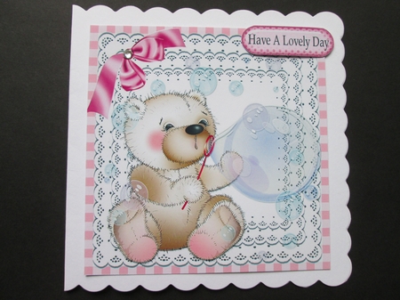 cute little bear blowing bubbles on lace with bow 8x8 by BELINDA ABRAHAM