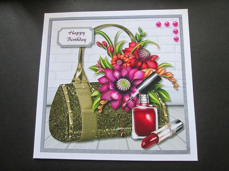 Gold bag with flowers by BELINDA ABRAHAM