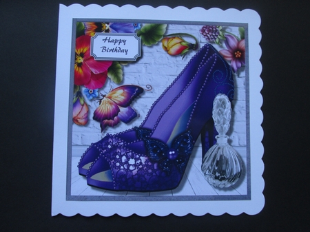 Purple butterfly shoes, perfume and floral corner by BELINDA ABRAHAM