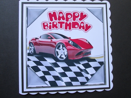 Red sports car in chequered effect frame 8x8 by BELINDA ABRAHAM