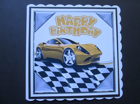 gold sports car in chequered effect frame 8x8 by BELINDA ABRAHAM