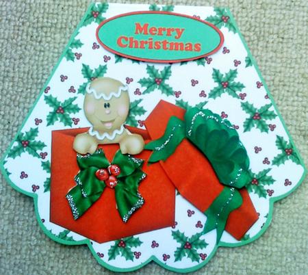 Gingerbread Man in Parcel with Bow Rocker Card by Belinda Ellingham