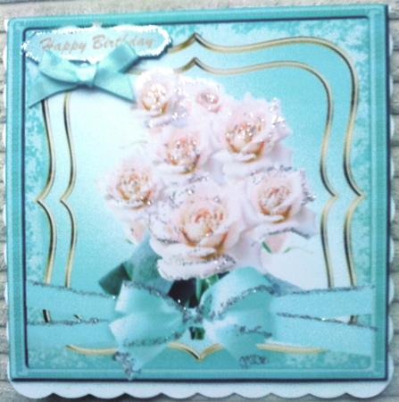 Lovely Cream Roses on a Aqua and Gold Mat by Belinda Ellingham