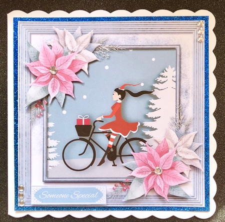 Christmas Girl on a bike paper art by Belinda Rub