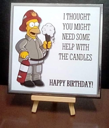 Homer thought you might need some help with the candles by Benita Jenkinson