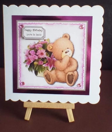 Teddy and flowers by Benita Jenkinson