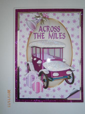 Across the Miles Pink Vintage Car with Snow & Horn A4 by Bernie Mclaughlin