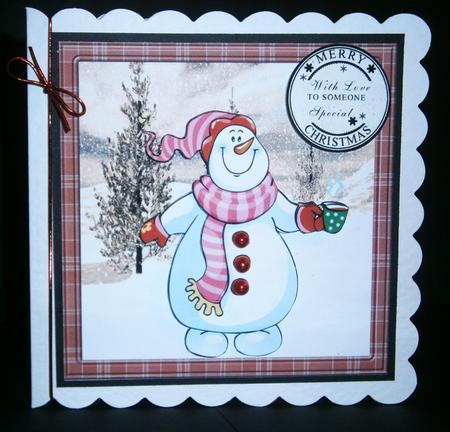 Snowman Has a Hot Chocolate to Keep Warm Card by Bernie Mclaughlin