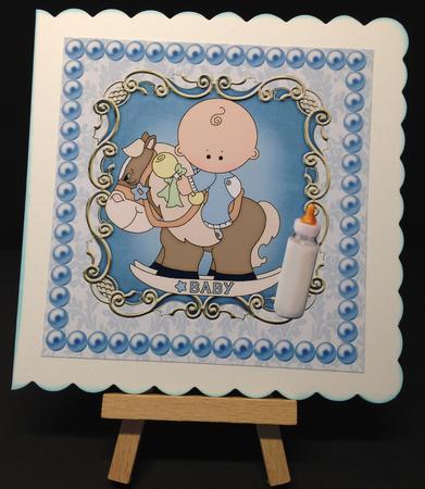 Baby Boy on a Rocking Horse, with His Bottle 8x8 by Bettina Keis Jensen