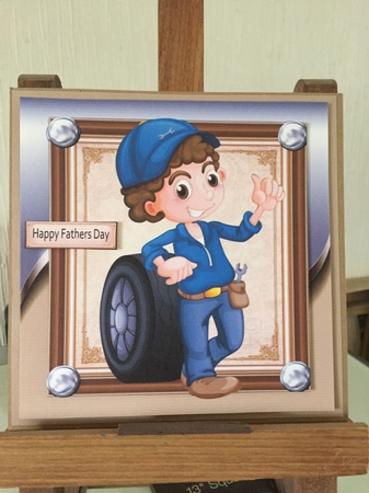 Mechanic With Tyre 8x8 by Beverley Hazelgrave