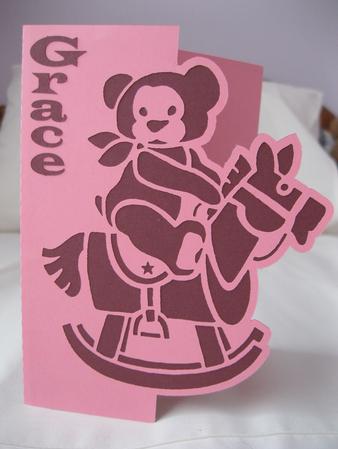 Rocking Horse Teddy Over The Edge Card by Beverley Rollings