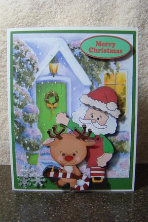 Santa with Reindeer with Candycane by Beverly Carmichael