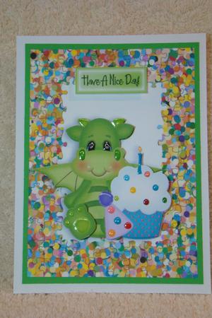 Little Green Dragon with Cupcake in Jigsaw Frame by Beverly Carmichael