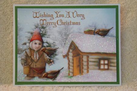 Gnome Feeding Birds in Orange with Cottage by Beverly Carmichael
