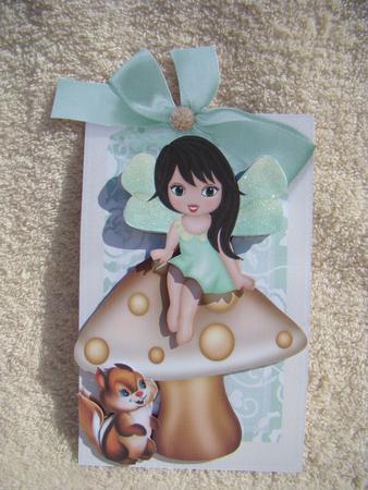 Faerie and Chipmunk Sitting on a Mushroom on a Tag by Beverly Carmichael