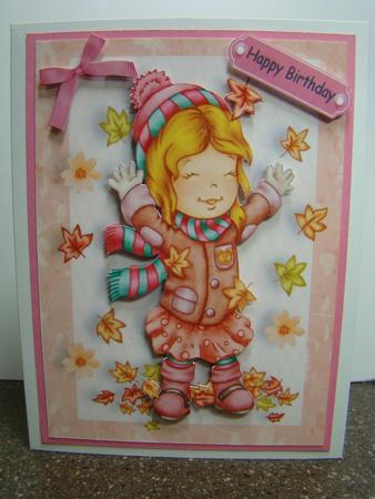 Little Girl Playing in the Autumn Leaves by Beverly Carmichael