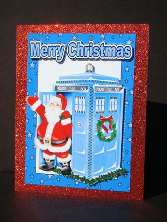 Santa Who in His Tardis in Blue Star Frame by Beverly Carmichael