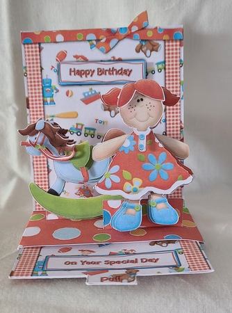 Toy Store Cute Girl with Rocking Horse Pop-up Slider Kit by Beverly Johnston