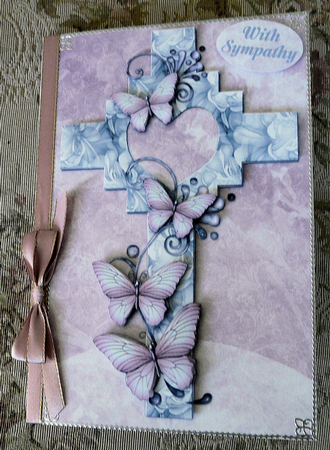 Blue & Pink Cross with Butterflies on Pink Floral Style Background by Brenda Scott