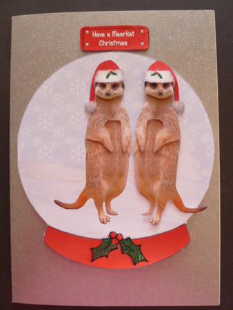 Christmas Meerkat in a Snow Globe by Carol Sear