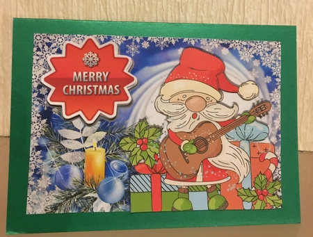Jolly Santa playing a guitar with  presents A4 by Carole McGregor