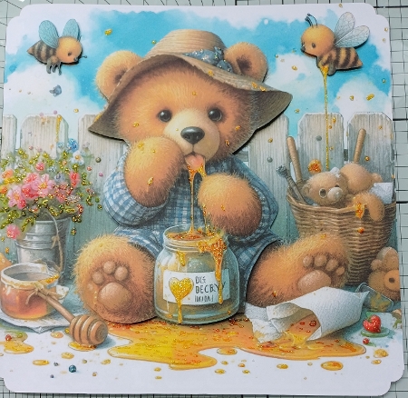 A cute, furry teddy bear happily eating honey by Michelle Sharpe