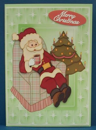 Santa Relaxing in His Chair on Green Backing Paper by Cheryl French