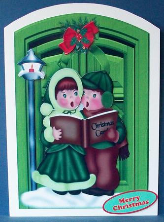 Carol Singers with Christmas Bow on Doors by Cheryl French