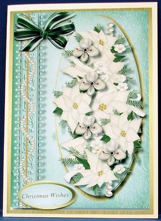 Lovely White Poinsettias in a Oval Frame  by Cheryl French