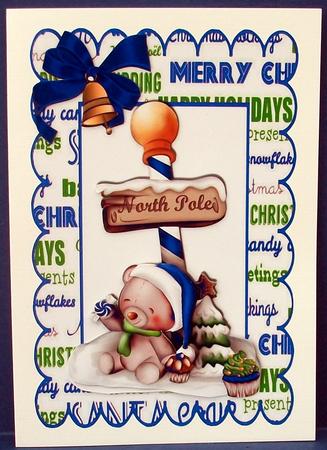 Little Teddy at the North Pole in Blue Santa Hat by Cheryl French