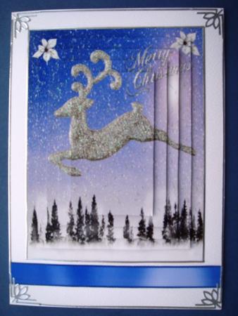 Silver Reindeer Flying Over Snowy Woodland, Pyramids by Christine Adcock