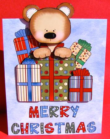 Merry Christmas Teddy Bear Over the Edge by Christine Pagan