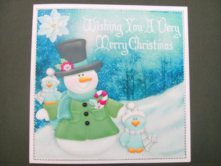 Snowman with Cute Little Birds in the Snow by Christine Sutton