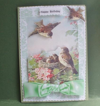 Spring is Here! Birds in a Nest with Bow by Christine Young