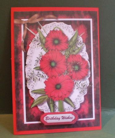 Beautiful Red Flowers on a Lace Mat  by Christine Young